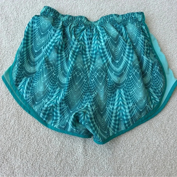 Women’s Nike Dri Fit Teal & Turquoise All Over Kaleidoscope Print Running Shorts - Picture 2 of 8